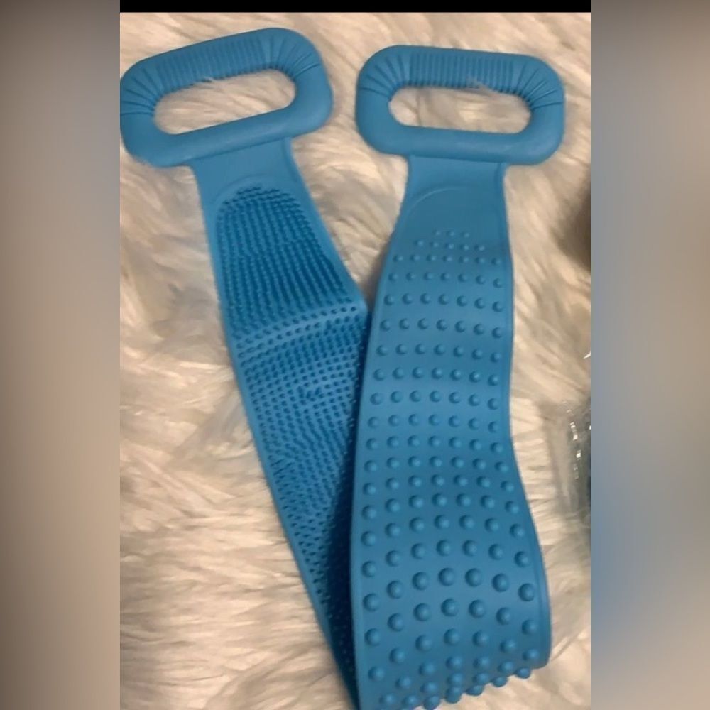 Exfoliating silicone blue back scrubber for shower with hook to hang in shower